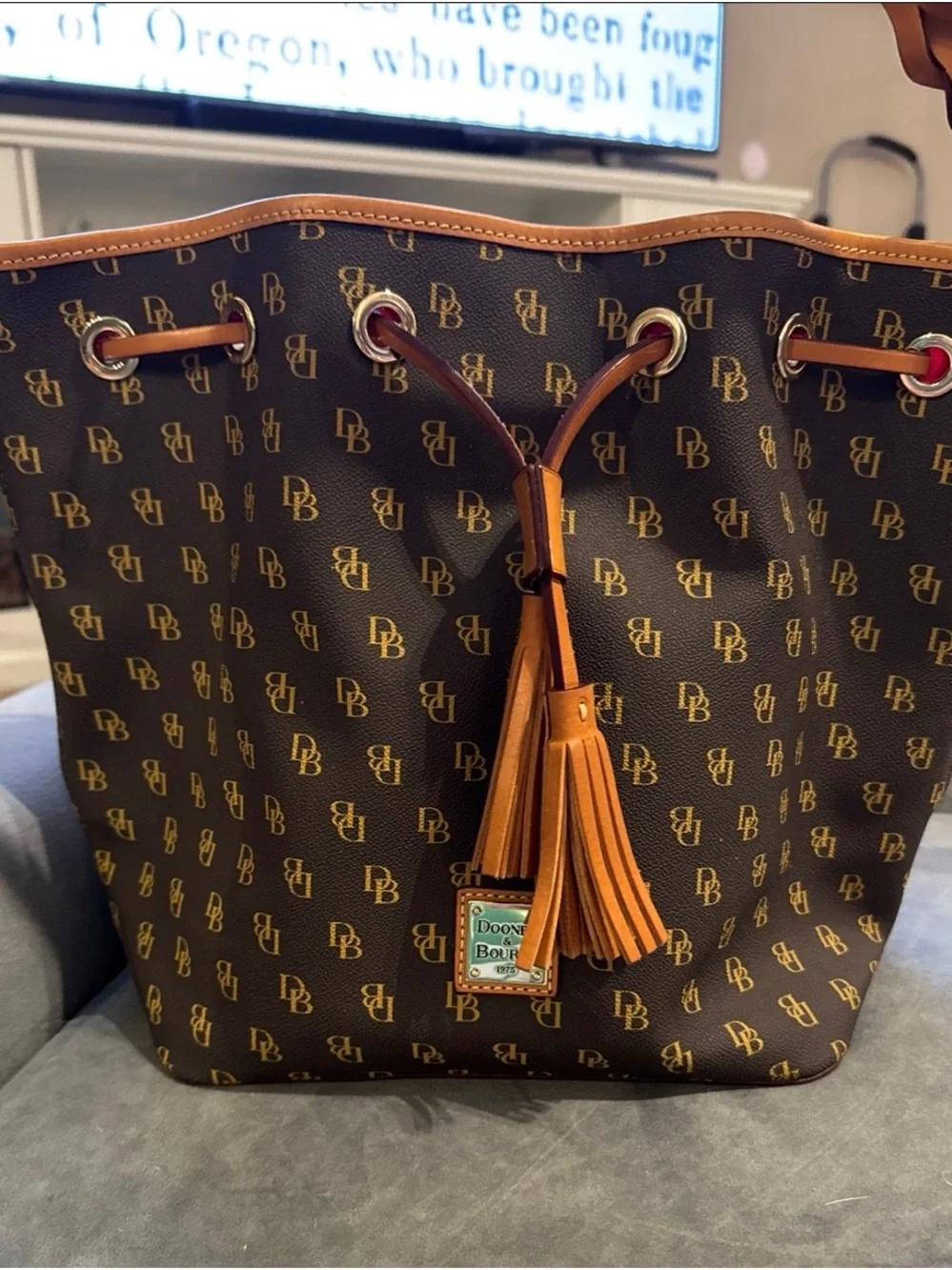 Dooney & Bourke Brown Monogram Drawstring Bucket Bag with Tan Trim